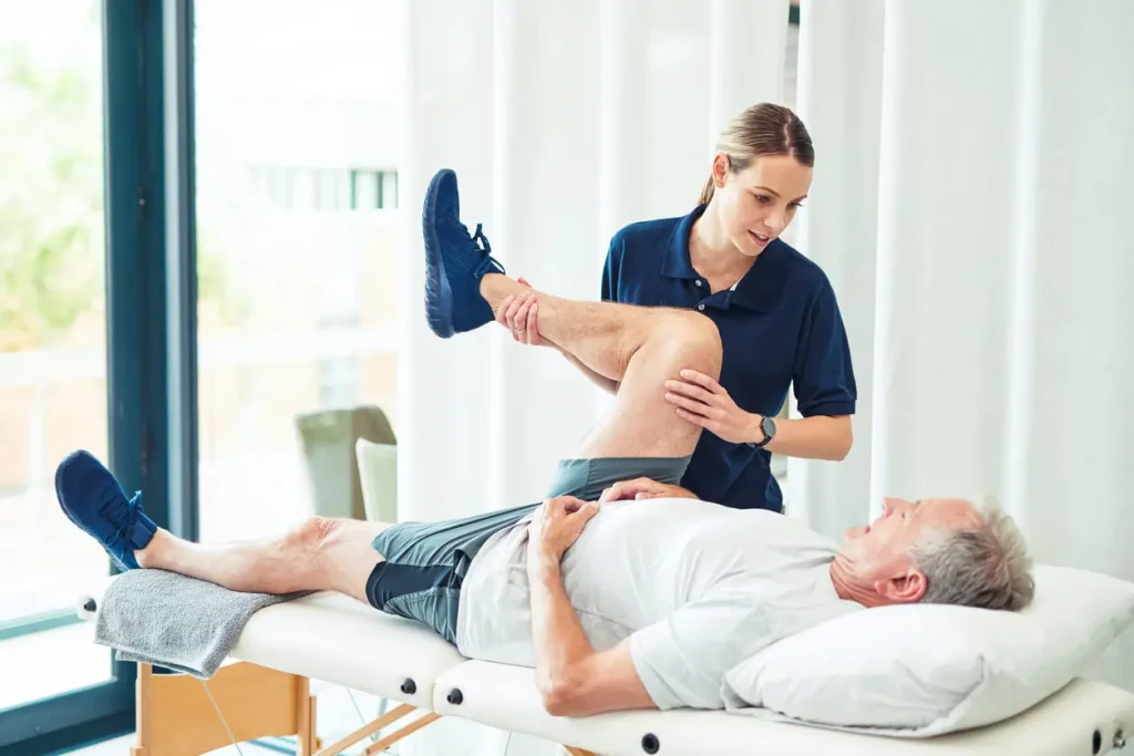 Revitalising Recovery: Effective Rehabilitation Strategies for Muscle Injuries 3 Physiotherapist assisting a patient with muscle recovery exercises Northamptonshire